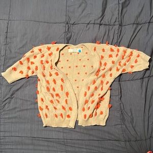 Fun tan and orange sweater